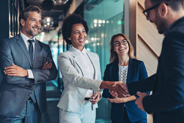 Multicultural businessmen shaking hands during business meeting